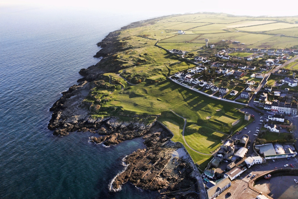Ardglass Golf Course perched above the Irish Sea, where rugged coastline meets scenic greens and village views.