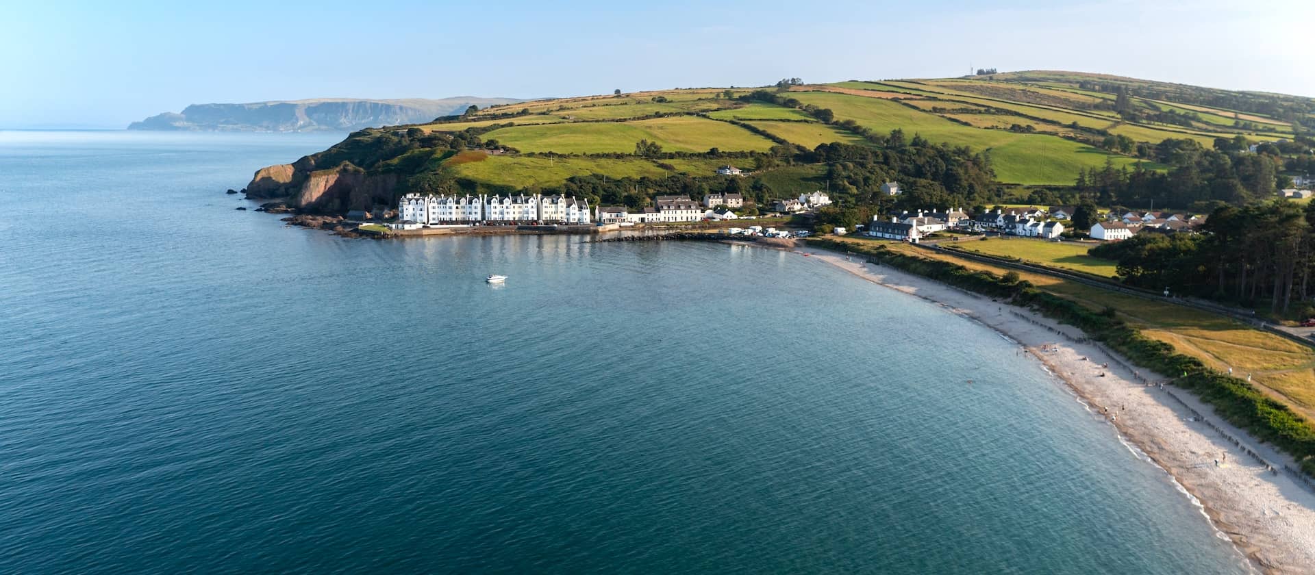 Aerial view of Cushendun village and beach on the Causeway Coastal Route, County Antrim.