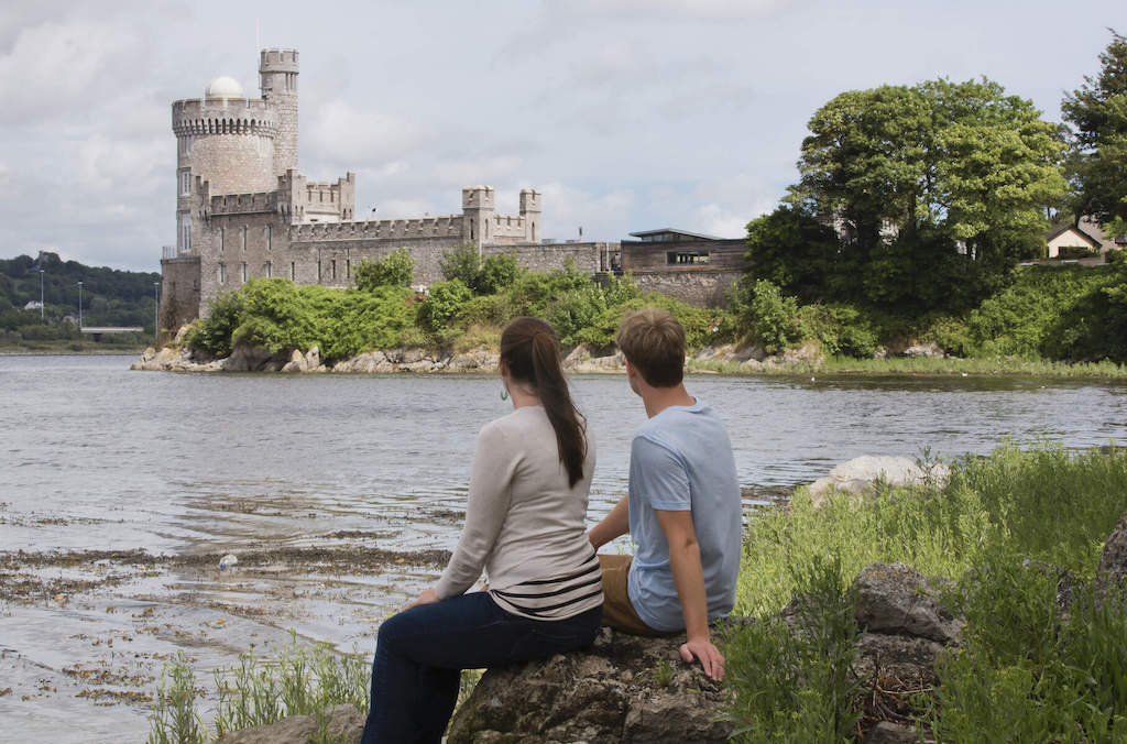 Couple seated by the water at Blackrock Castle Observatory, Cork.