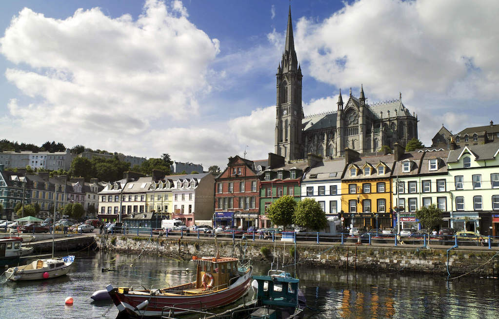 Colourful harbourfront buildings and fishing boats in Cobh, County Cork.