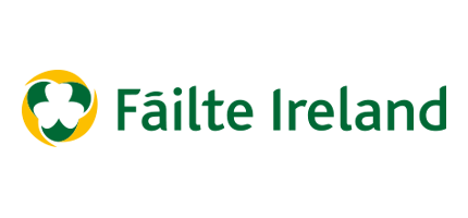 Fáilte Ireland logo with a green and yellow circular emblem and text in Irish-style font.