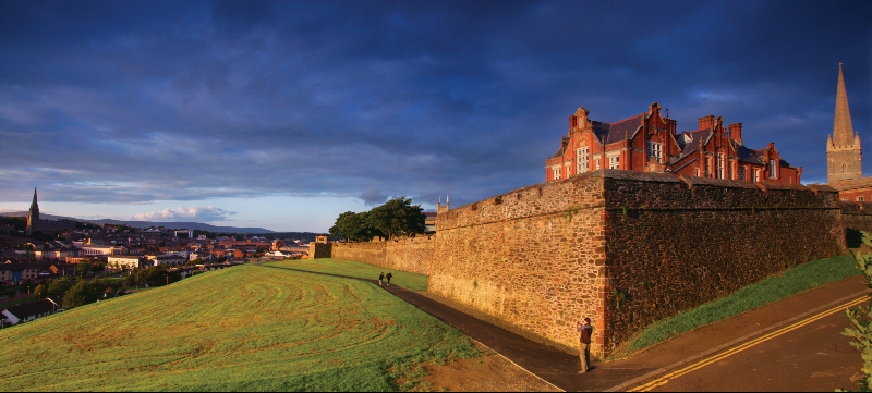 The 17th-century city walls of Derry, historic fortifications offering views across the vibrant old town.