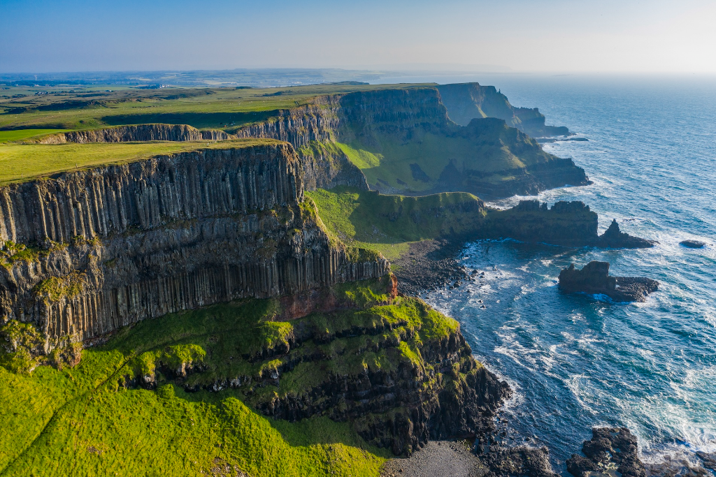 Aerial view of the Giant’s Causeway basalt cliffs and coastline on the Causeway Coast, County Antrim.