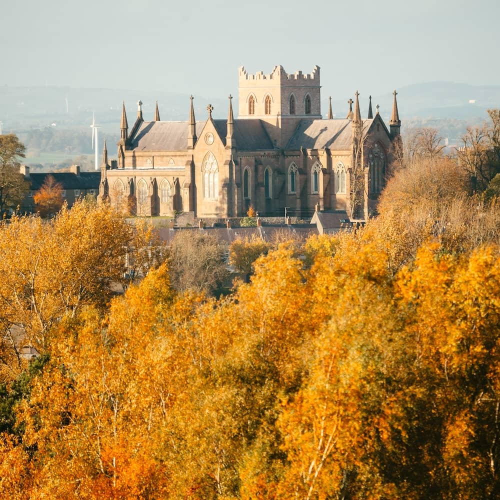 St Patrick’s Cathedral rising above golden autumn foliage in Armagh City, County Armagh.