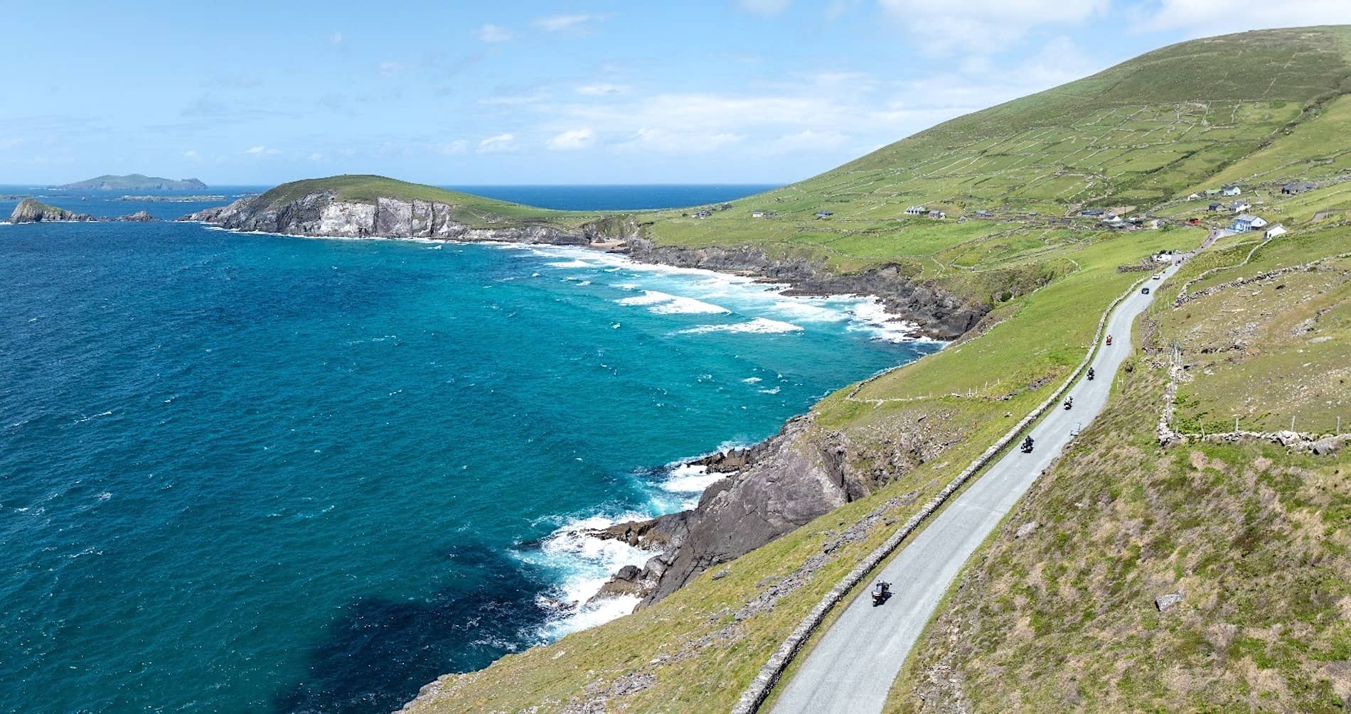 Motorcyclists riding the scenic coastal roads of County Kerry during Ireland BikeFest Killarney.