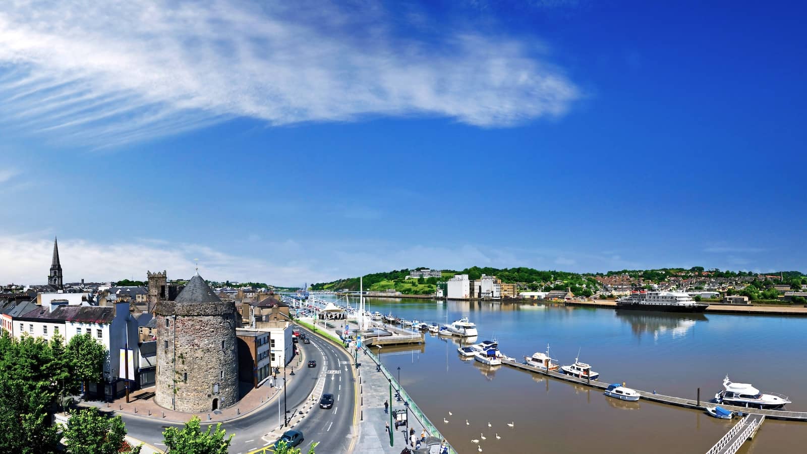 Aerial view of Reginald’s Tower and Waterford marina beside the River Suir on a bright summer day.