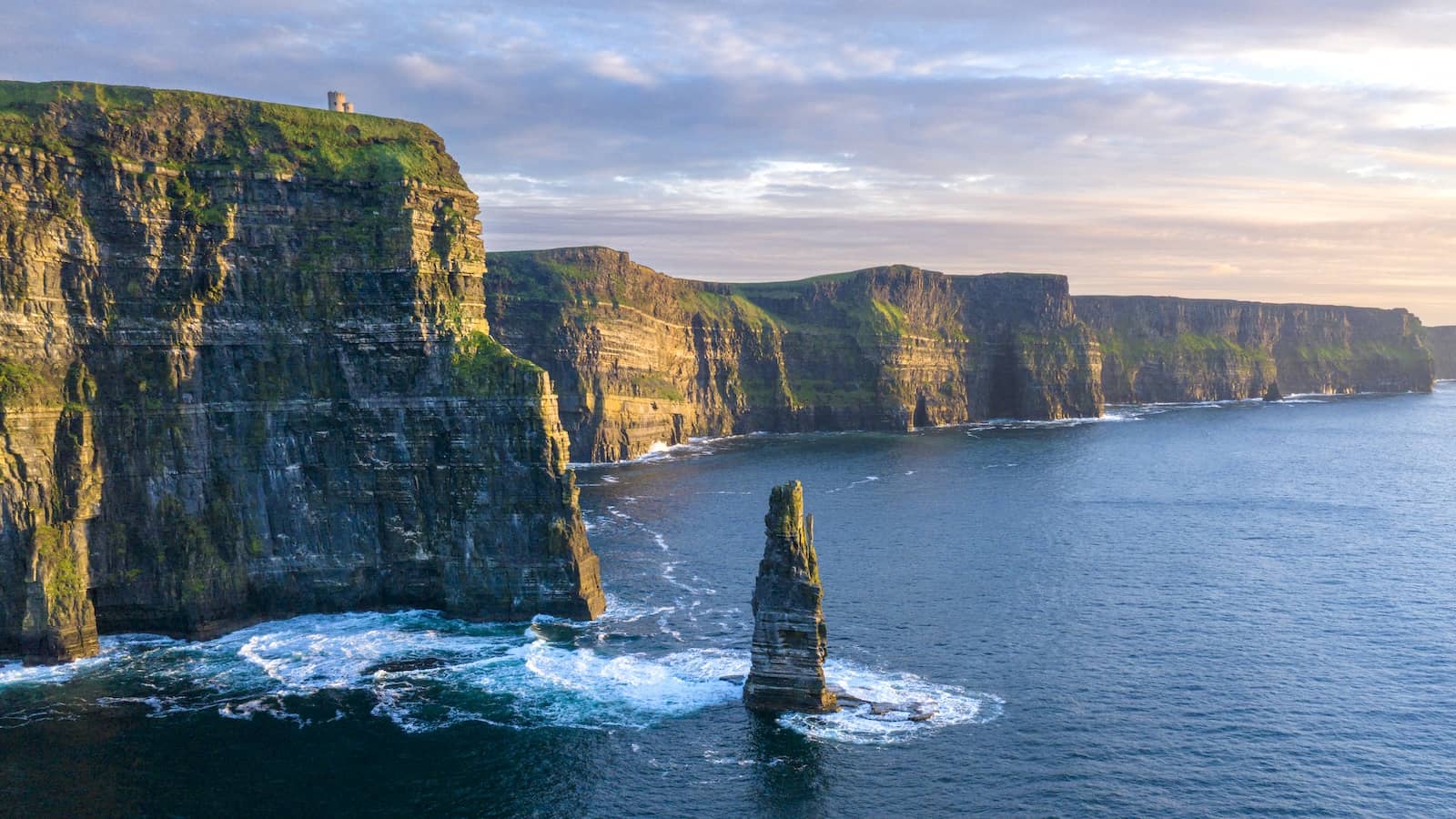 Dramatic aerial view of the Cliffs of Moher rising above the Atlantic Ocean along the County Clare coastline.