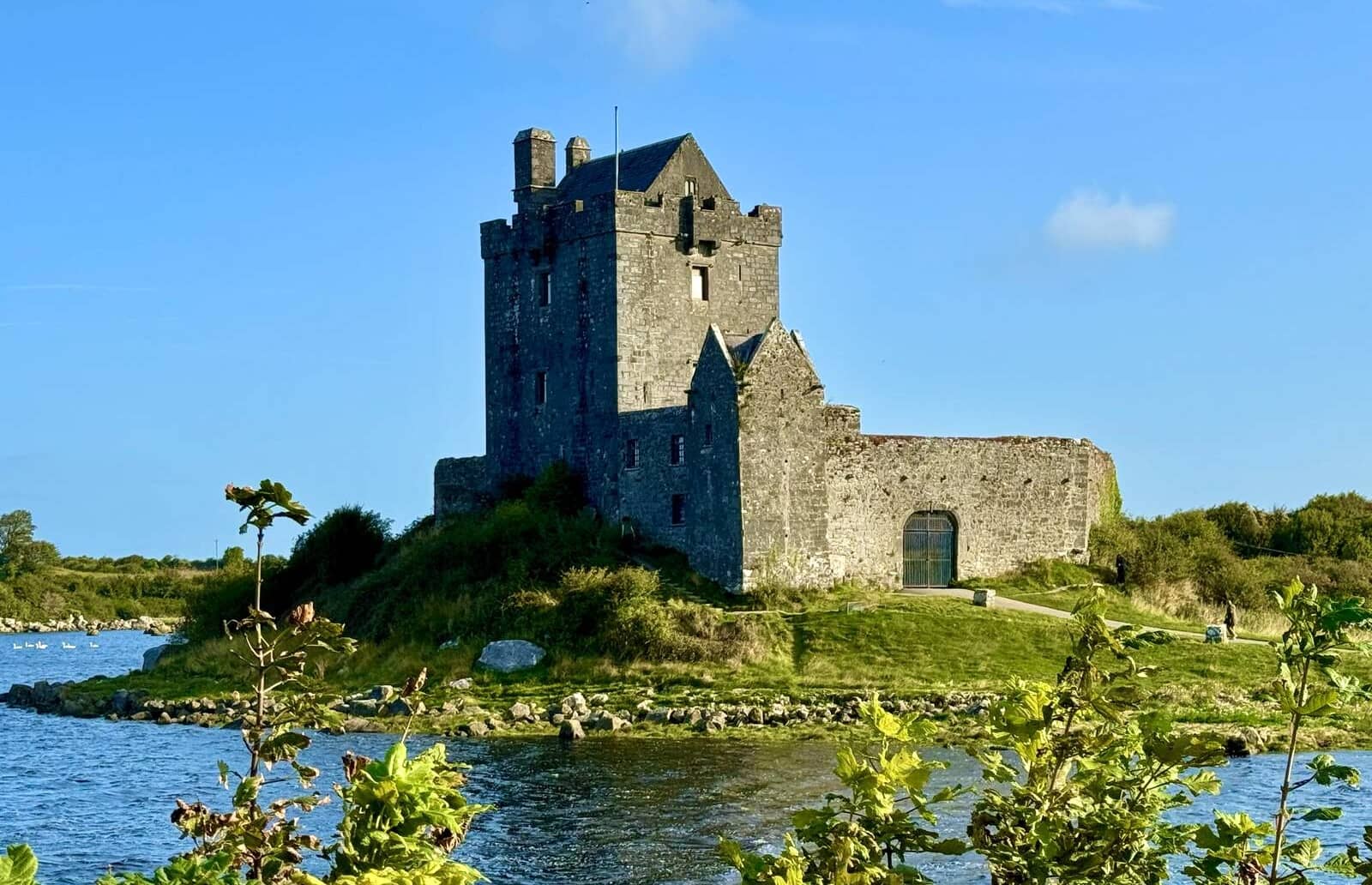 Medieval Dunguaire Castle standing beside the water near Kinvara in County Galway.