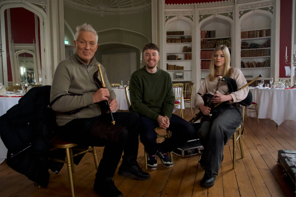Martin and Roman Kemp with a young uilleann piper in a grand Irish country house.