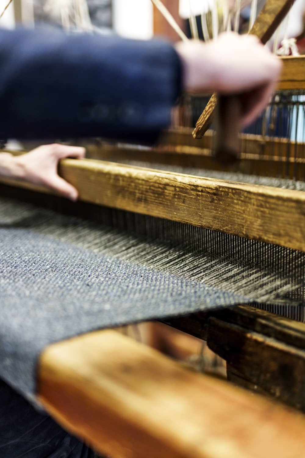 Traditional Magee tweed being handwoven on a loom in Donegal Town, County Donegal.