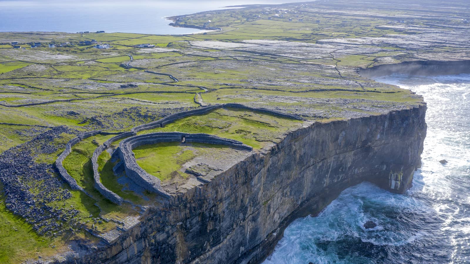 Dún Aonghasa sits dramatically on sea cliffs above the Atlantic on the Aran Islands, County Galway.