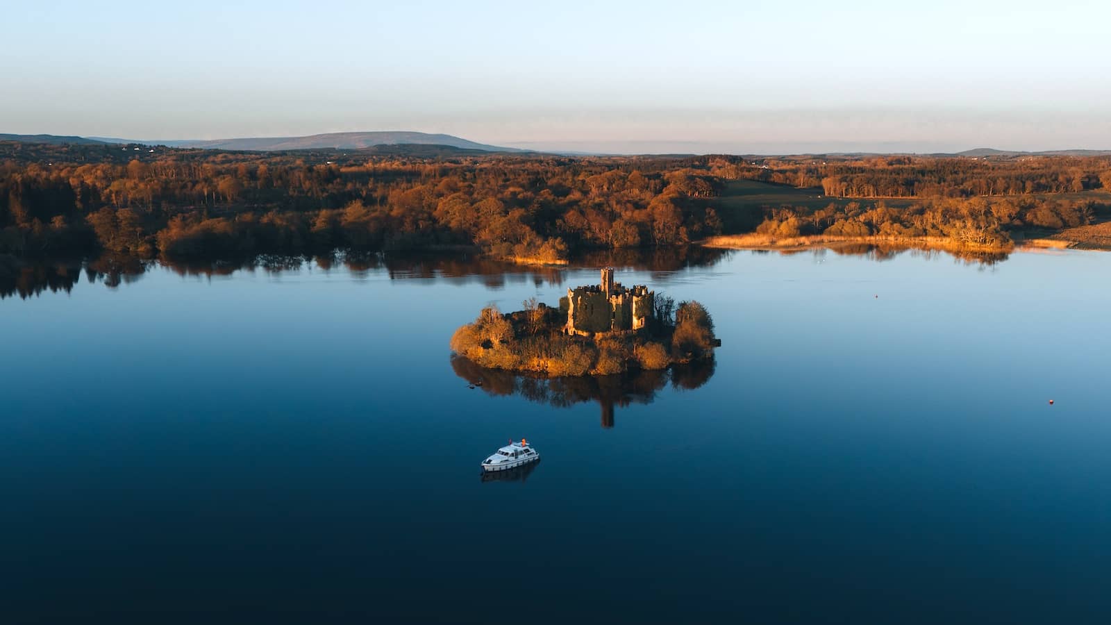 McDermott’s Castle stands on a small island in Lough Key at golden hour, County Roscommon.