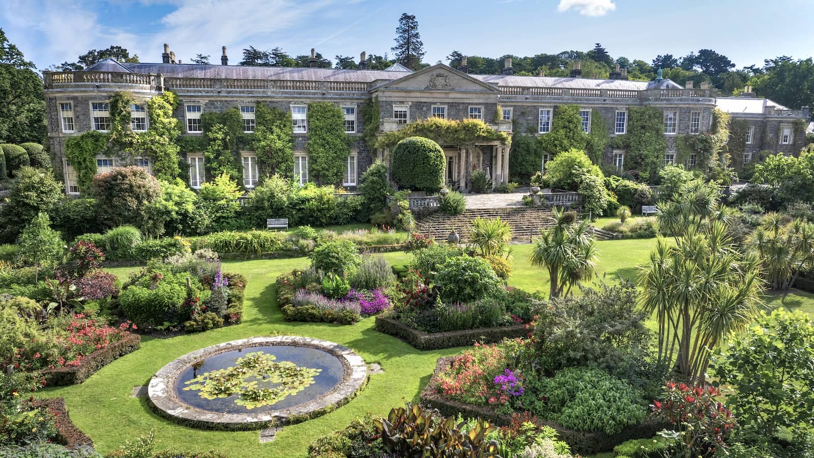 Mount Stewart’s grand house overlooks formal gardens and a lily pond on the shores of Strangford Lough, County Down.