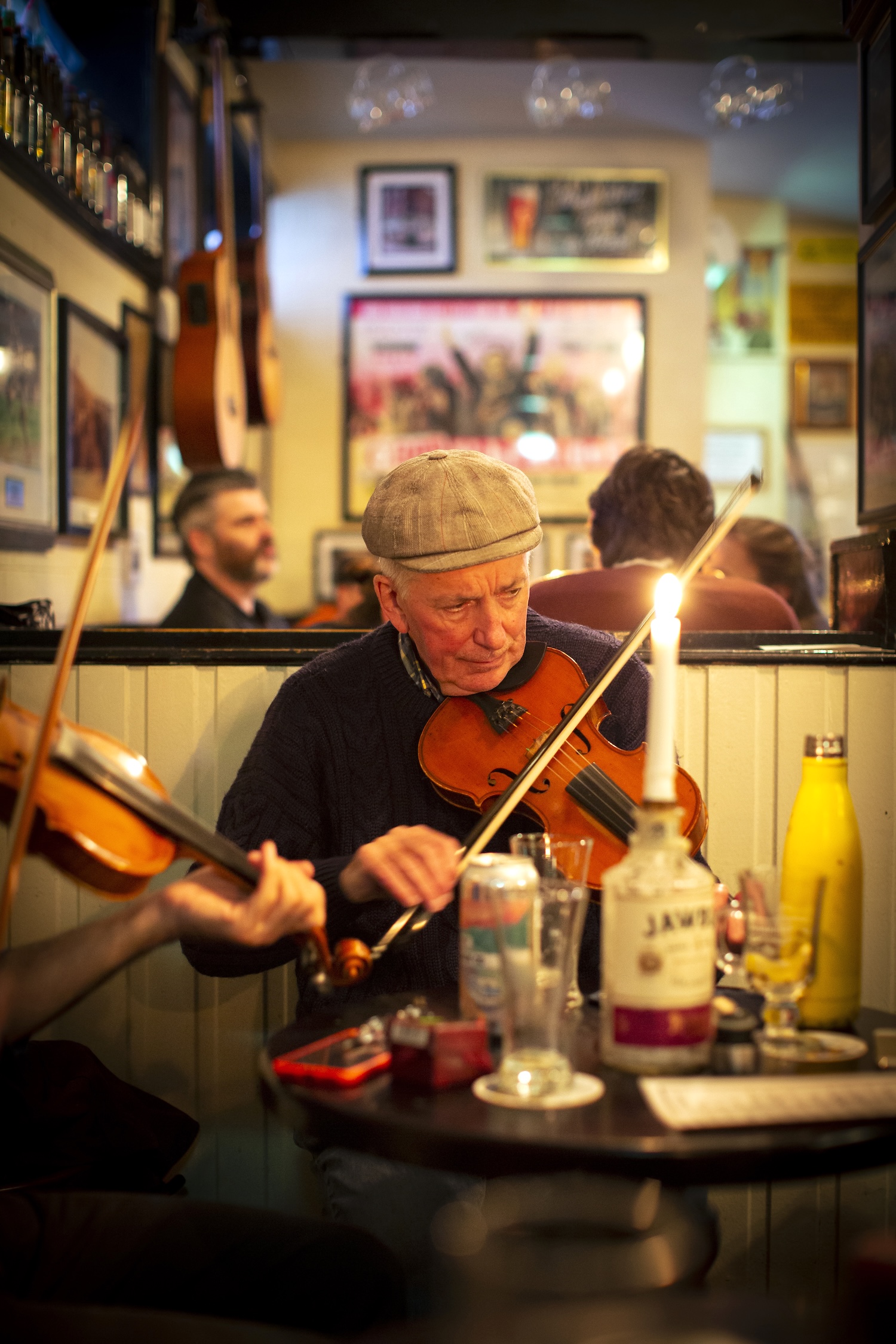 Traditional Irish fiddle player performing live inside The Sunflower pub in Belfast, Northern Ireland.