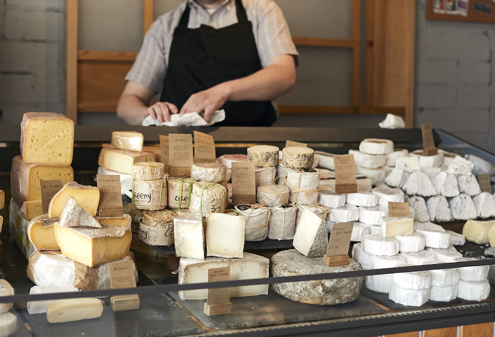 A wide selection of artisan cheeses displayed at a cheese shop in Belfast’s Cathedral Quarter.