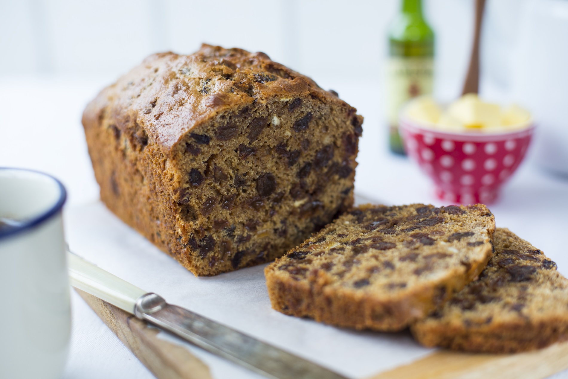 A traditional Irish barmbrack fruit loaf, sliced and ready to serve with butter.