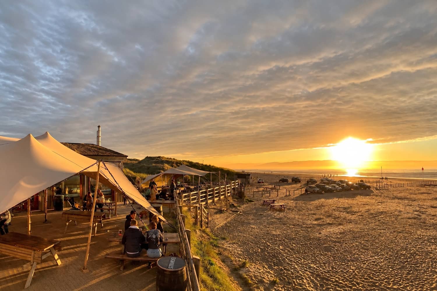 Sunset dining beside the beach at Harry’s Shack on the County Londonderry coast.
