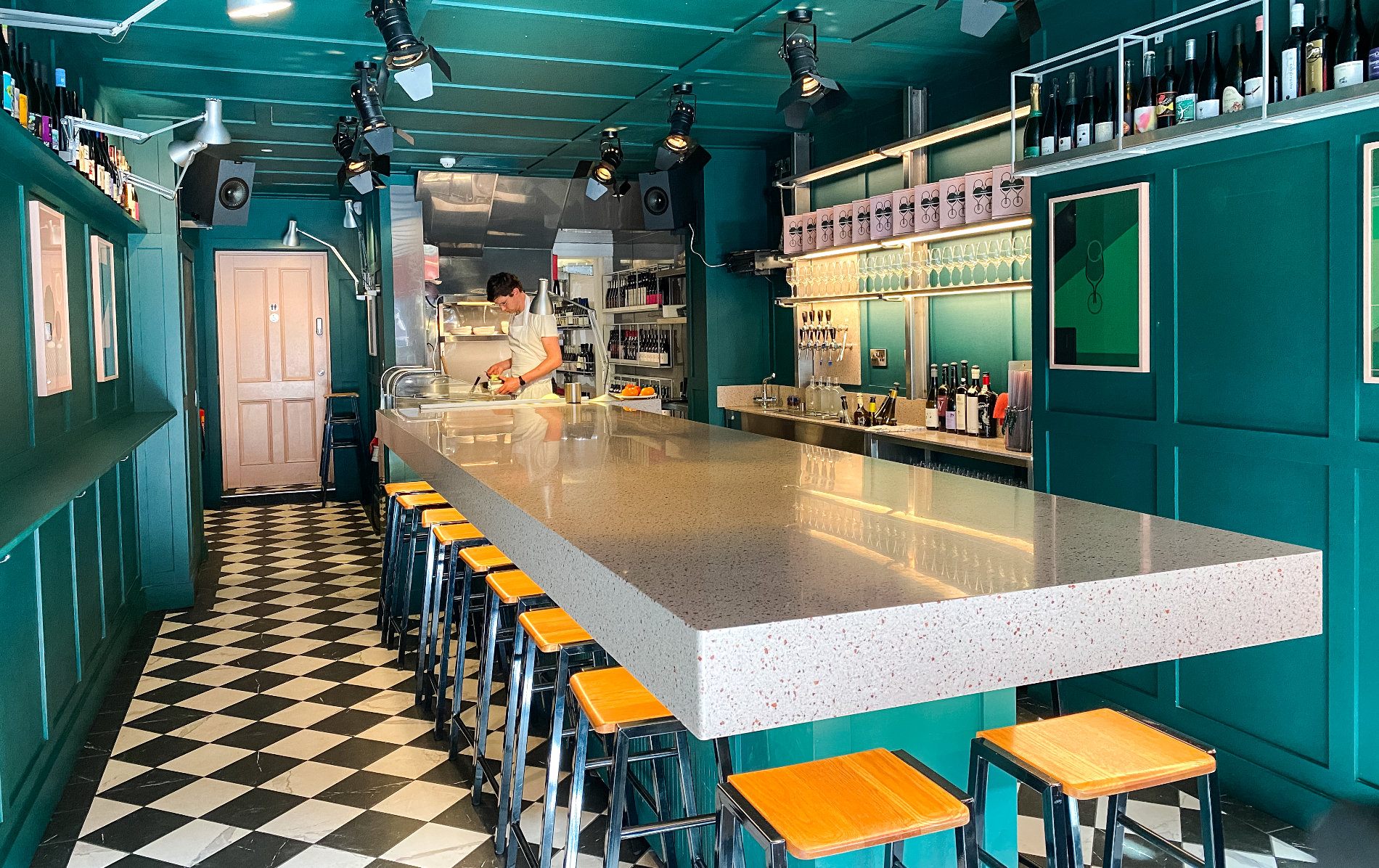 Teal walls, counter seating and an open kitchen create a stylish interior at Frank’s in Dublin.