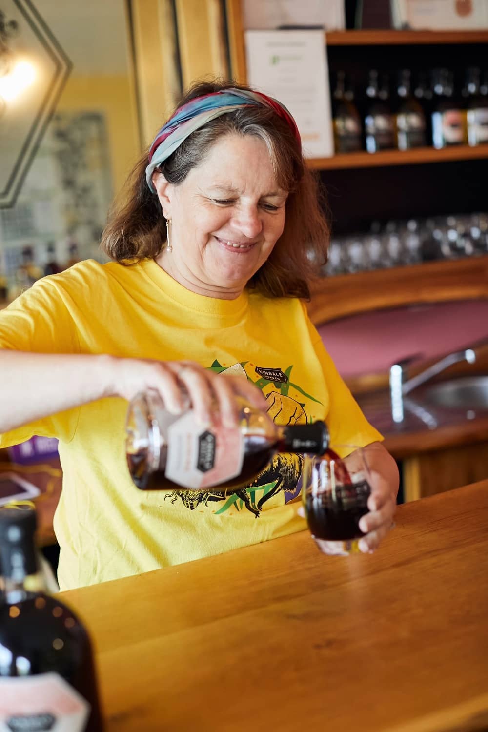 Kate Dempsey pouring a glass of mead at Kinsale Mead Co. in County Cork, Ireland.