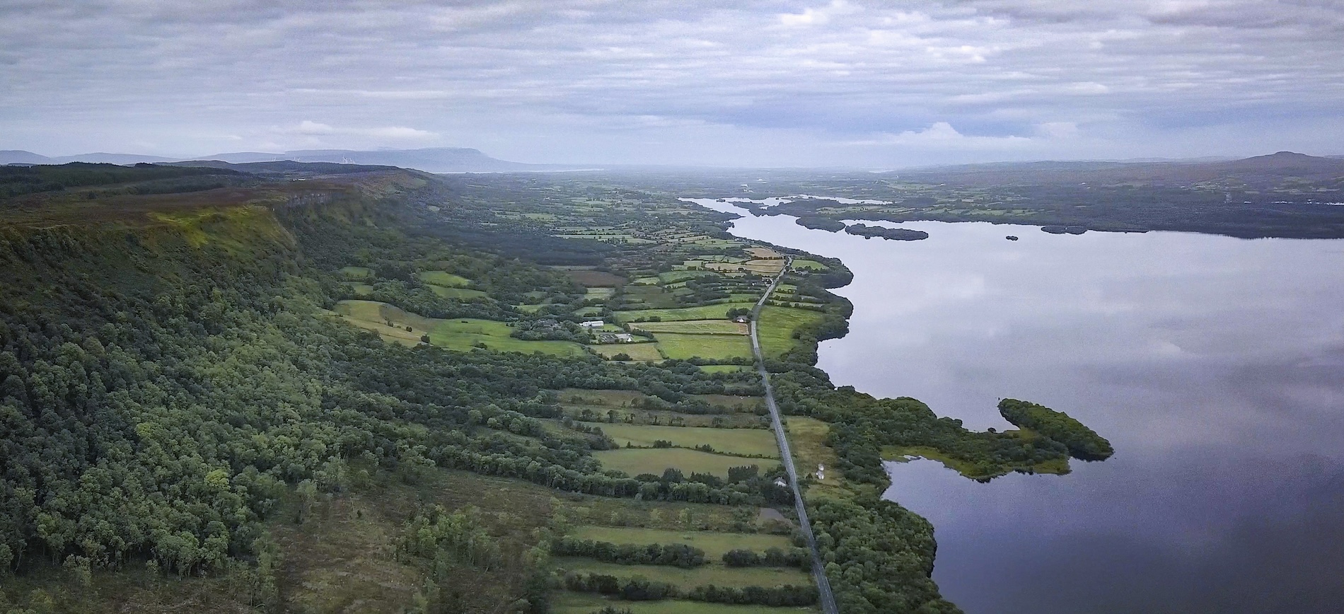 Aerial view of Magho Cliffs overlooking forest, farmland and Lower Lough Erne in County Fermanagh.