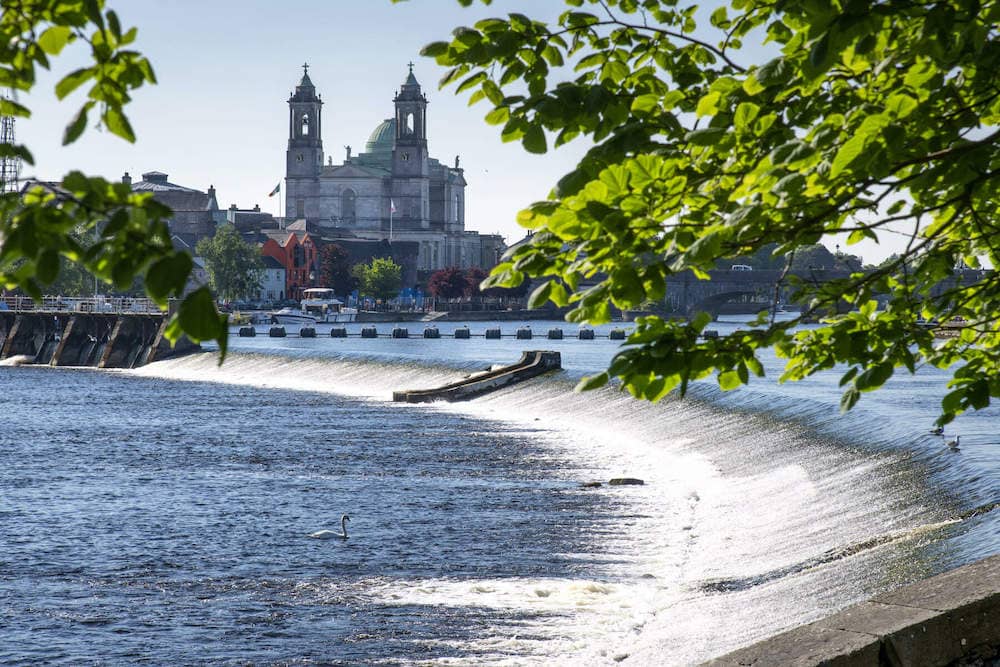 River Shannon cascading over the weir in Athlone with St. Peter and Paul’s Church in the background.