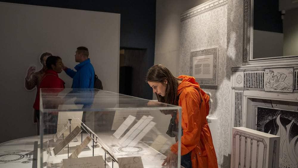 Visitors view displays and historic documents in a gallery at the National Famine Museum, Strokestown.