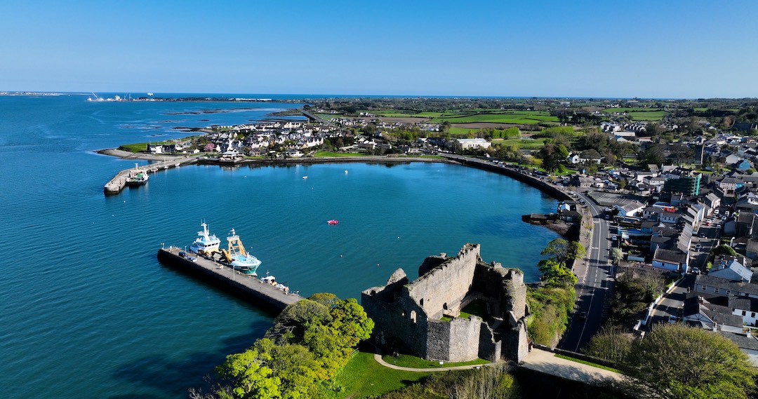 King John’s Castle overlooking Carlingford Harbour and docked boats on Ireland’s east coast.