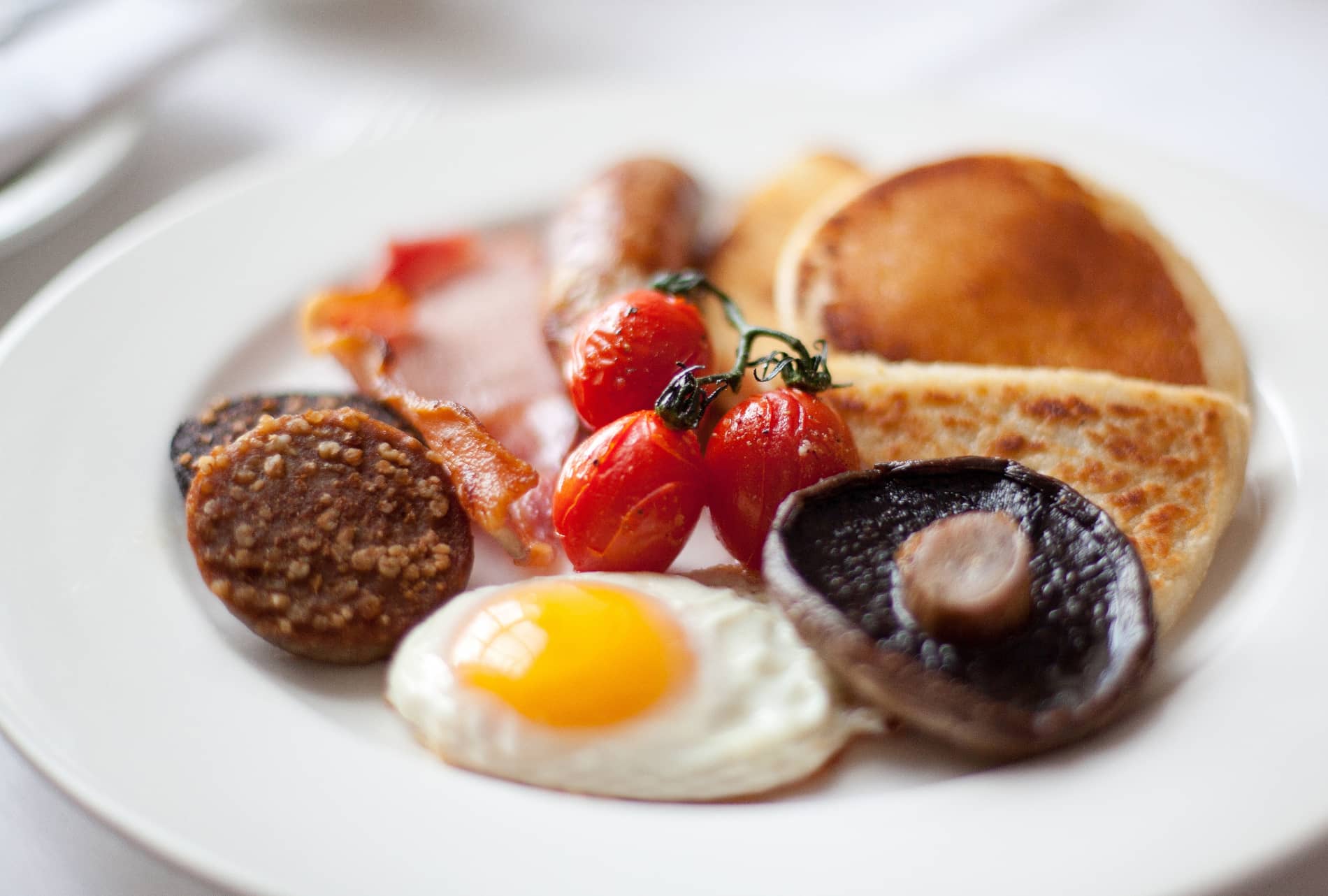 Traditional Ulster fry breakfast at Newforge House with egg, soda bread, black pudding, bacon, tomato and mushroom.