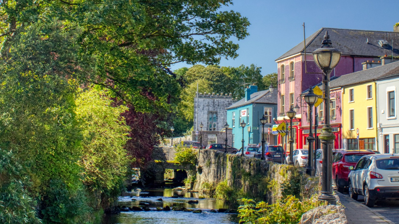 Colourful street and river in Newcastle West along the Limerick Greenway.