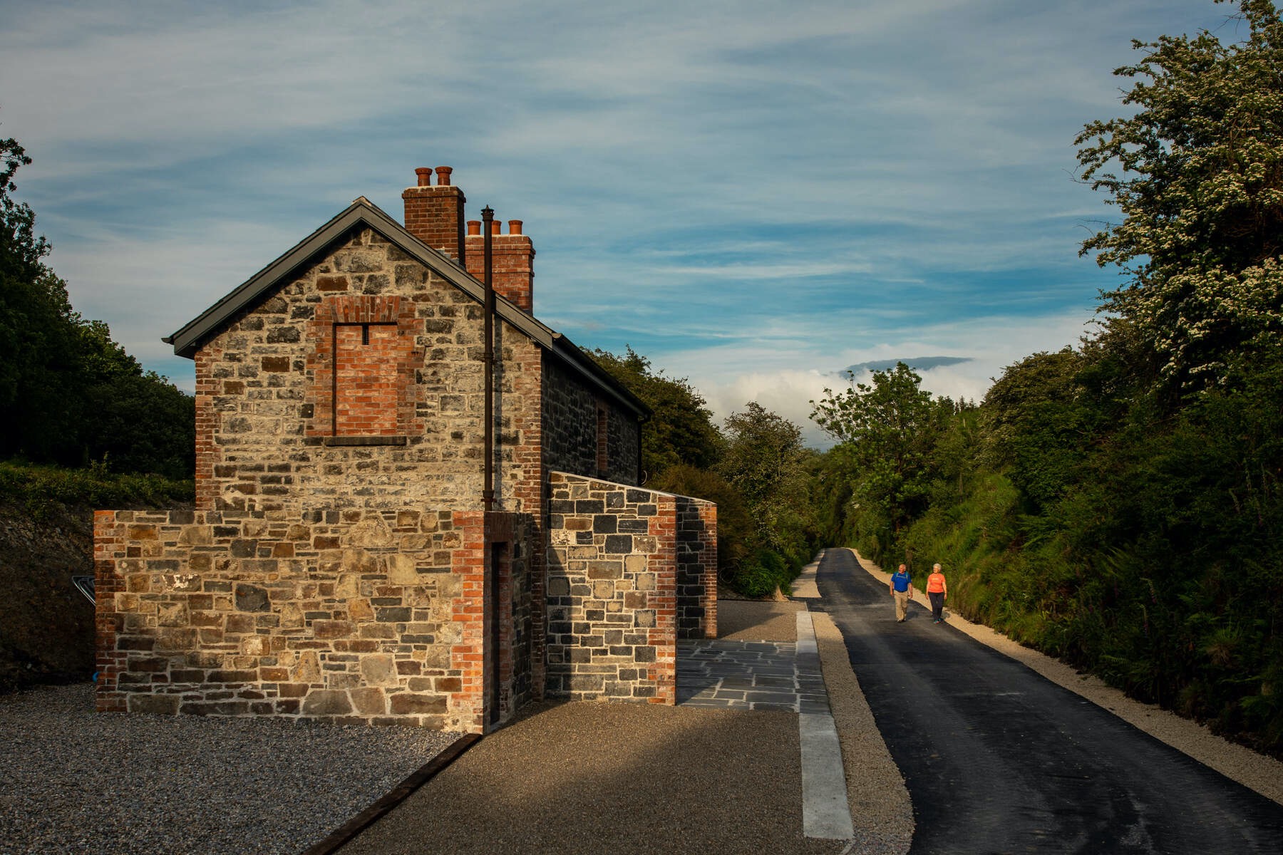 Restored stone railway building beside the Limerick Greenway trail.