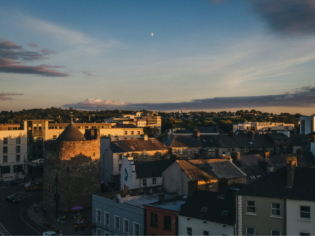 Sunset over Waterford city with views of Reginald’s Tower and surrounding buildings.