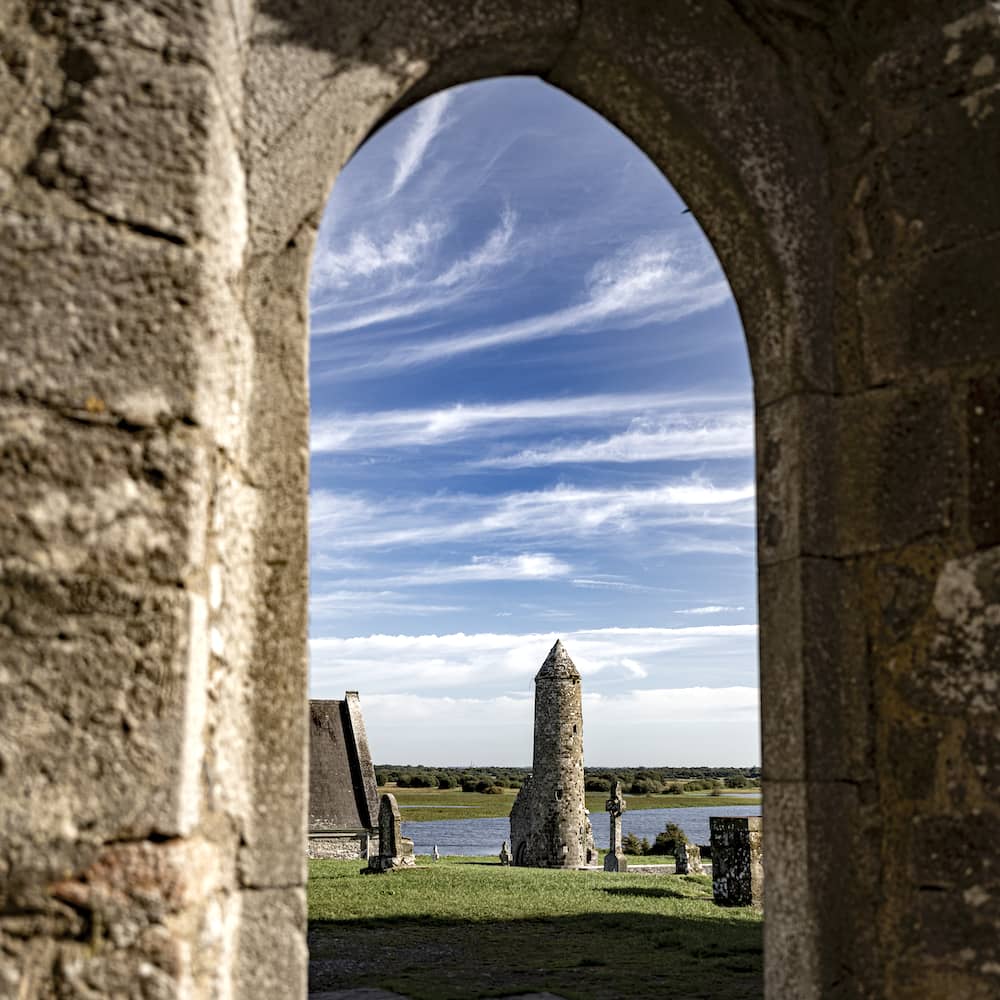 Clonmacnoise monastic site and round tower overlooking the River Shannon in County Offaly, Ireland.
