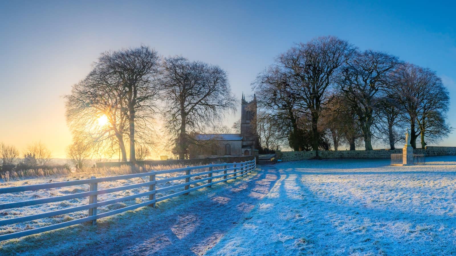 Frosty country path leading to the Hill of Tara church at sunrise, County Meath.