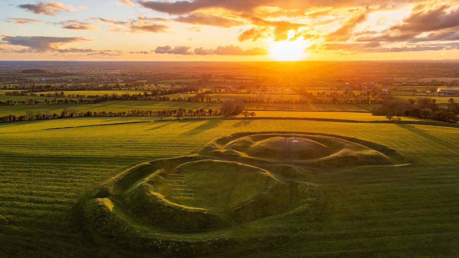 Sunrise over the ancient grassy earthworks at the Hill of Tara, County Meath.