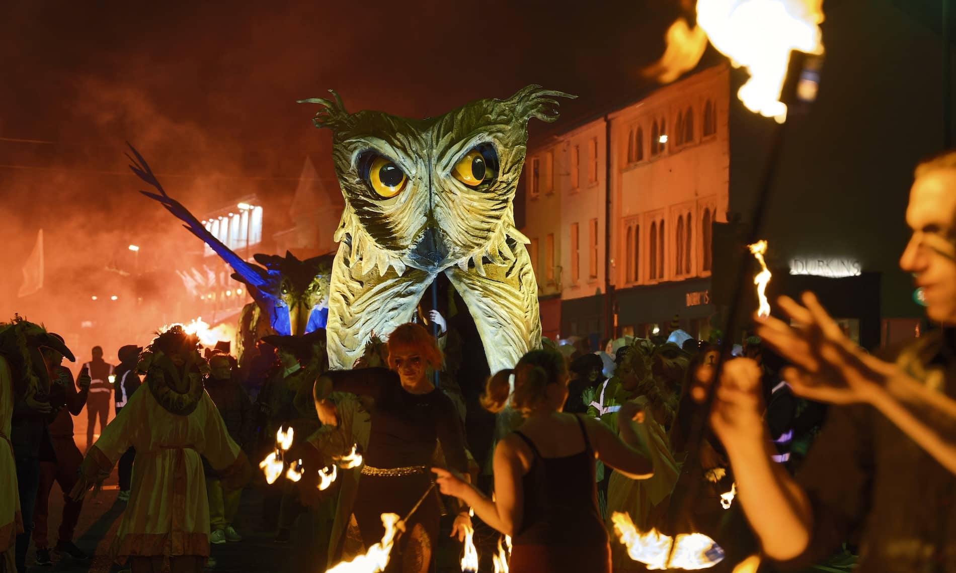 Fire performers surround a giant owl puppet at the Samhain Festival in Longford.