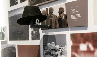 Exhibit at Seamus Heaney HomePlace featuring historic family photos and Patrick Heaney’s hat on display.