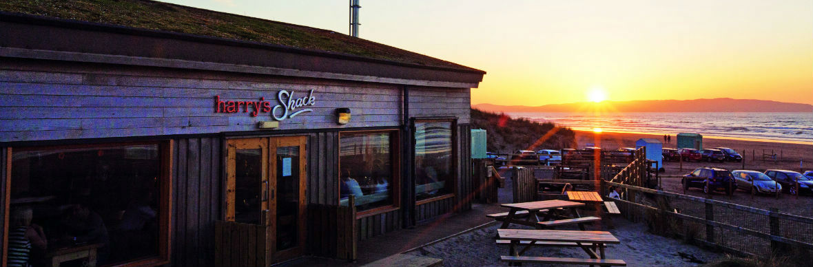 Harry’s Shack restaurant at sunset overlooking the beach in Portstewart, County Londonderry.