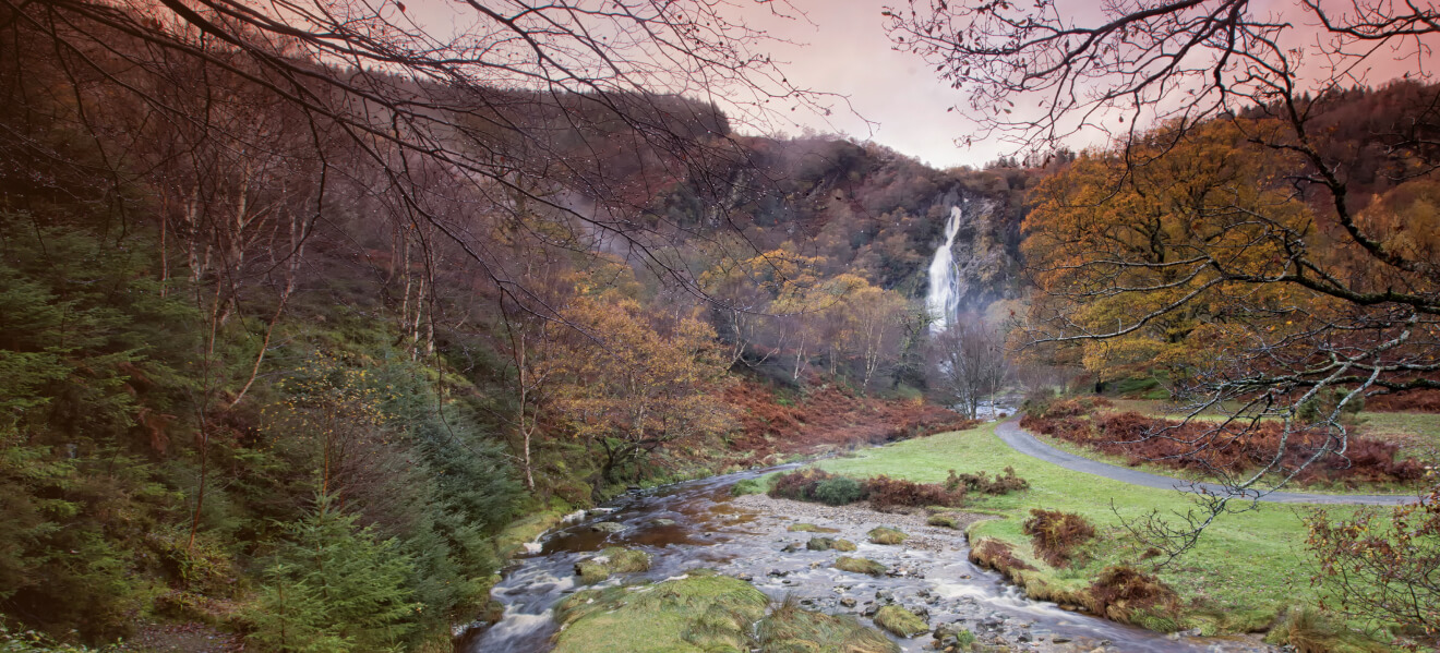 Ireland’s highest waterfall at Powerscourt surrounded by autumn woodland in County Wicklow.
