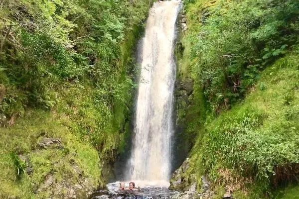 Waterfall Swimming&comma; Exclusive to Far & Wild