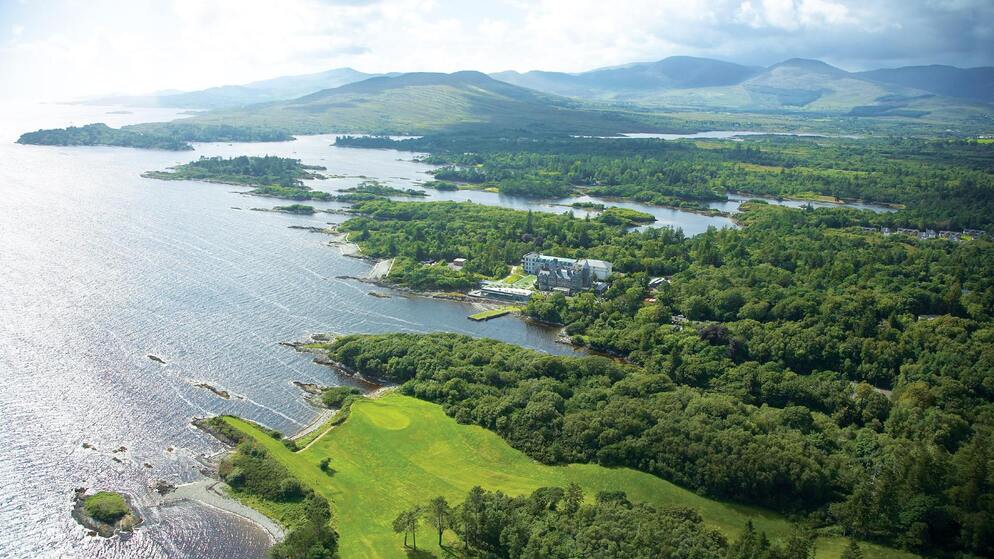 Aerial view of Parknasilla Resort surrounded by woodland and mountains in County Kerry.