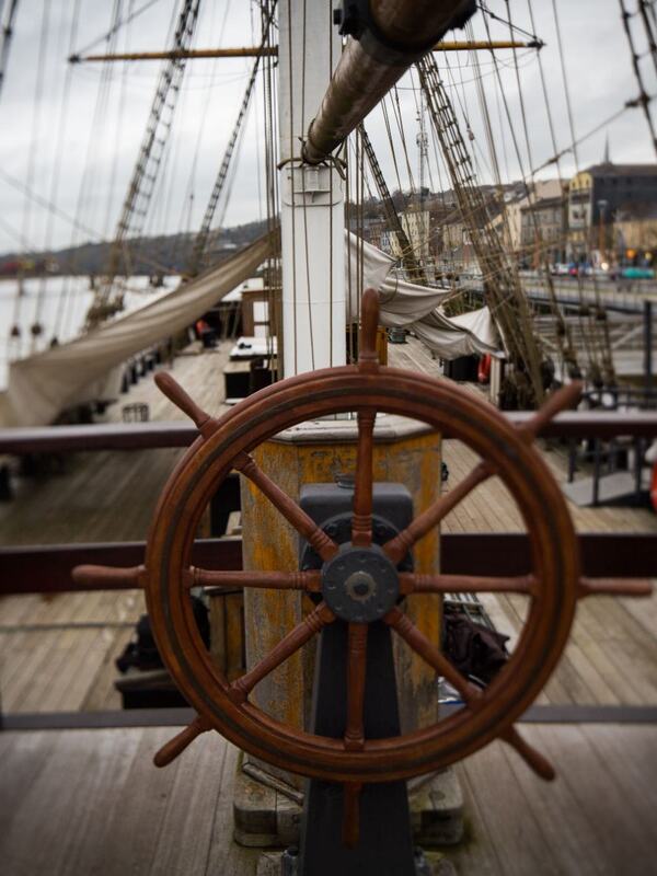 Wooden ship’s wheel and rigging overlooking New Ross Quay in County Wexford, evoking Ireland’s maritime heritage.