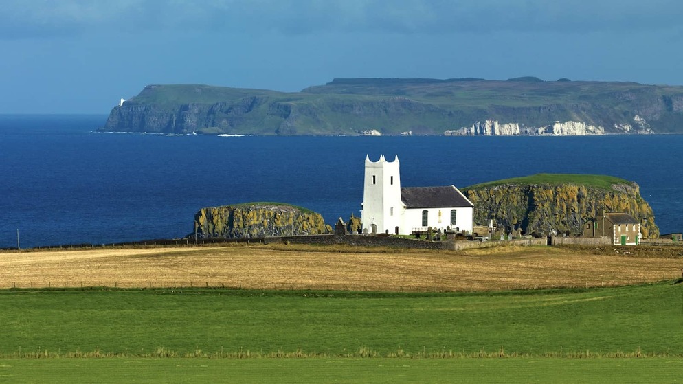 Ballintoy Church on the County Antrim coast, Northern Ireland, overlooking the Atlantic Ocean and Rathlin Island.
