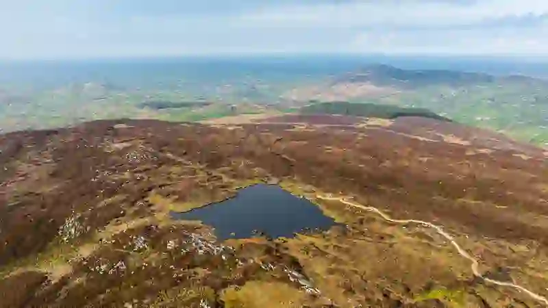 Aerial view of Slieve Gullion’s hills and mountain lake overlooking County Armagh.