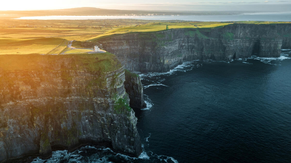 Sunset light over the Cliffs of Moher and Atlantic coastline in County Clare.