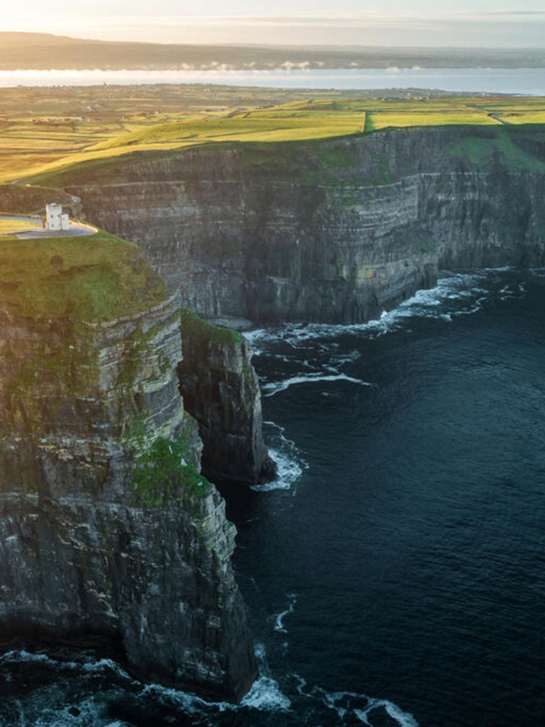 Sunset light over the Cliffs of Moher and Atlantic coastline in County Clare.