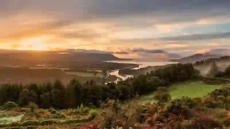 Sunrise view from Flagstaff Viewpoint over Carlingford Lough, with forest, hills and Newry in County Down.