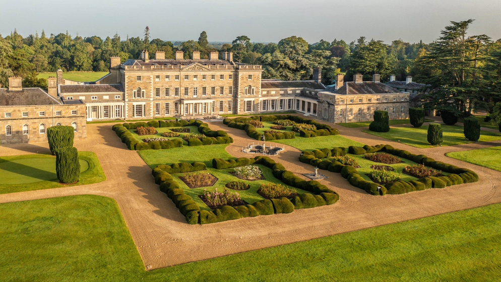 Aerial view of Carton House and its formal gardens, with manicured lawns and woodland beyond in County Kildare.