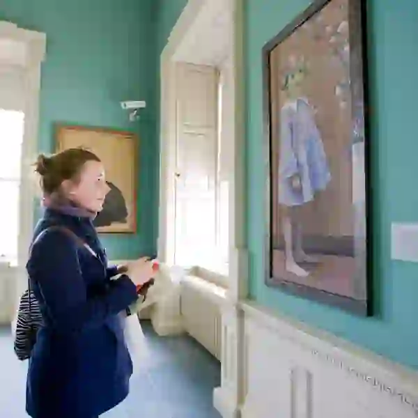 Visitor viewing artwork inside The Hunt Museum, Limerick city.