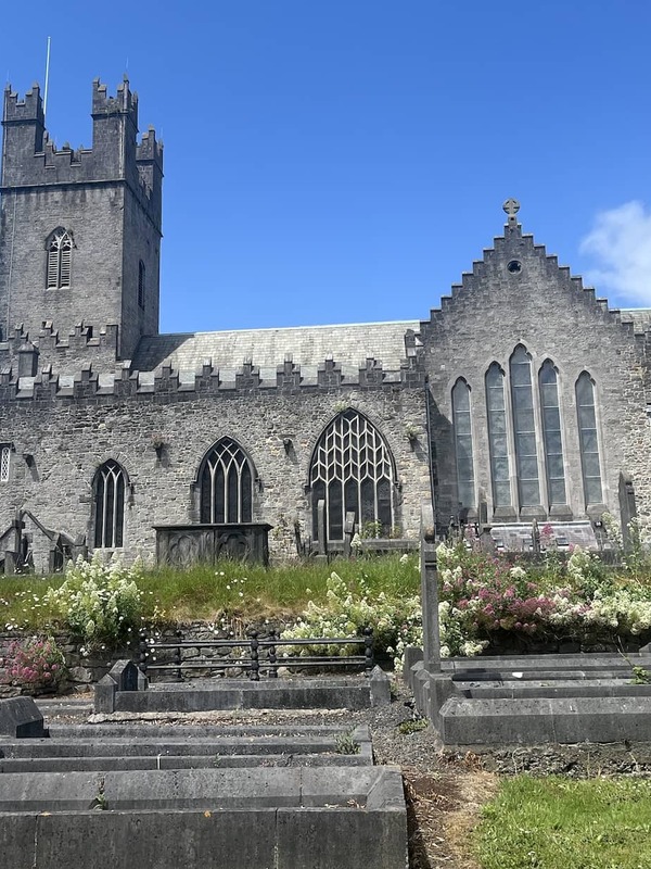 St Mary’s Cathedral and historic graveyard in Limerick city beneath a bright blue sky.