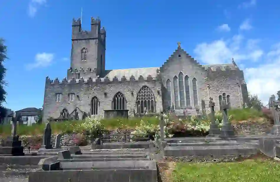 St Mary’s Cathedral and historic graveyard in Limerick city beneath a bright blue sky.